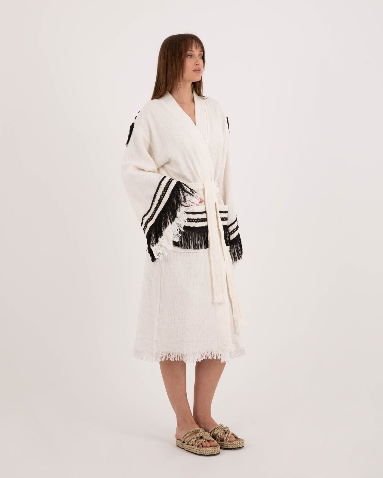 Black tassel robe by Just Jas featuring a chic design with flowing fabric and elegant tassel details.